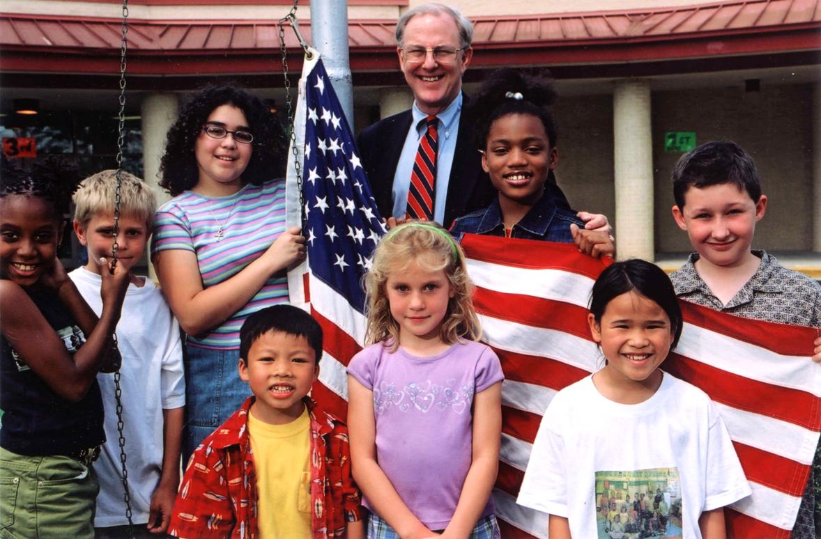 Joe with kids and flag